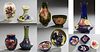 Fourteen Pieces of Moorcroft Pottery, 20th c., consisting of four bowls, four baluster vases, a candlestick, a covered baluster jar,...