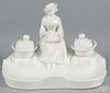 Porcelain figural inkwell, late 19th c., bearing a mark on base, 6 3/4'' h., 9 1/4'' w.