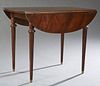 American Carved Mahogany Circular Drop Leaf Dining Table, c. 1950, opening to accept four 12 inch leaves, H.- 29 1/2 in., W.- Closed...
