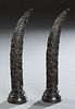 Pair of Oriental Faux Animal Horns, 20th c., the composition horns with relief dragon and octopus decoration, on integral stepped ci...