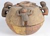 African carved and polychrome painted ceremonial divination bowl of the Yoruba people, 10'' h.