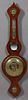 Carved Mahogany Lainton Halifax Aneroid Barometer, 19th c., of banjo form, with a thermometer over a small mirror, a barometer and a...