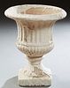 White Glazed Terracotta Campana Form Garden Urn, early 20th c., with ribbed sides, on a socle support, to a square base, H.- 19 1/4...