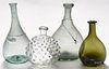 Four blown and blown-molded glass bottles, 19th c., to include aquamarine, green, and colorless