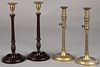 Pair of brass and carved mahogany candlesticks