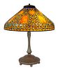 A RARE TIFFANY STUDIOS LEADED GLASS AND BRONZE "RUSSIAN" TABLE LAMP, NEW YORK, 1910