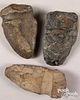 Three massive ancient stone axe heads