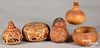 Three carved Peruvian gourds