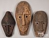 Three carved Timor tribal masks