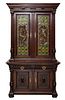 FRENCH RENAISSANCE-REVIVAL STAINED-OAK COLORED LEAD-GLASS AND BRONZE-INSET STEPBACK BOOK CASE CABINET, LATE 18TH CENTURY