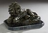 Juno, "A Snarling Lion," 20th/21st c., patinated bronze signed proper left rear, on an octagonal highly figured black marble base, H.- 10 1/2 in., W.-