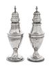 A Near Pair of George III Silver Casters