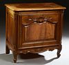 French Louis XV Style Carved Walnut Confiturier, 20th c., the stepped parquetry inlaid rounded corner and edge top over a wide fielded panel cupboard 