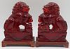 Pair of Carved Cherry Amber? Foo Dogs on Stands.