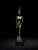 An Egyptian Bronze Striding Neith
Height 5 7/8 inches.