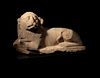 An Egyptian Limestone Recumbent Lion
Height 10 3/4 x width 18 inches.
