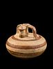 A Mycenaean Pottery Stirrup Jar
Height 4 1/2 inches.
