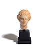 A Greek Marble Head of Aphrodite
Height 3 1/2 inches.