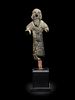 A Near Eastern Bronze Figure of a Man
Height 3 inches.