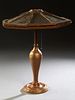 American Gilt Spelter Table Lamp, c. 1920, with a wooden eight parchment paneled shade, on a baluster relief support to a stepped circular base, H.- 2