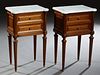 Pair of French Louis XVI Style Carved Walnut Marble Top Nightstands, 20th c., the ogee edge cookie corner figured white marble over two drawers, on tu