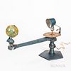 Unmarked Cast Metal Tellurion, manual gear-driven 4-in. dia. two-part tin globe, paper zodiac dial below the electric socket, manual-wi