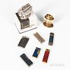 Eight Lighters, a Ronson "Queen Anne" in original box; three enameled and metal Dunhills; a Bugatti; a Ronson "Leona"; and two IM Coron