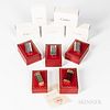 Five Cartier "Briquets" Lighters, all with original inner and outer boxes and paperwork, including a "Miniature Briquet" in a gold and