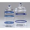 Two Blown Blue and Clear Glass Covered Storage Jars