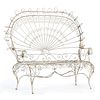A Victorian White Painted Spiraled Metal Outdoor Love Seat
