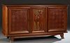 French Art Deco Carved Walnut Sideboard, c. 1930, the stepped rounded corner basketweave top over two large basketweave cupboard doors, flanking a cen