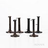 Six Iron "Hogscraper" Push-up Candlesticks, England, 19th century, of typical form, some with makers' marks on the push-up tabs, (two w