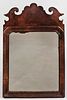 Queen Anne Walnut Veneer Mirror, probably England, late 18th century, scrolled crest above a shaped molded liner, old glass, ht. 18 in.