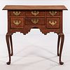 Queen Anne Walnut Dressing Table, Massachusetts, c. 1740-60, the molded overhanging top above a case of six thumb-molded drawers and ca