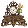 TABLE CLOCK, FRANCE, 19th century, Golden metal, Decorated with a polychrome peasant figure, rope mechanism and pendulum, 11.8" (30 cm)