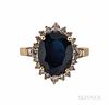 18kt Gold, Sapphire, and Diamond Ring, prong-set with an oval-cut sapphire measuring approx. 12.40 x 10.00 x 5.60 mm, framed by full-cu