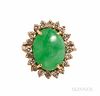 14kt Gold, Jade, and Diamond Ring, the oval cabochon measuring approx. 14.50 x 11.00 x 6.0 mm, framed by full-cut diamonds, size 5 3/4.