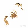 Three 14kt Gold Animal Jewelry Items, two brooches: a crab and pelican, with ruby eyes; and a dolphin-form enhancer with emerald eye, 1