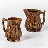Two Rockingham Glazed Pitchers, 19th century, with molded cranes on the sides, ht. to 8 1/2 in.