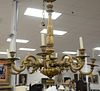 Italian giltwood eight-light chandelier with fluted arms, gadrooned stem and scroll arms, fitted for electricity, 20th C., arms repaired, ht. 45", wd.