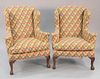 Pair of Chippendale style geometric upholstered wing armchairs, ball and claw feet. 44" x 34" x 26".