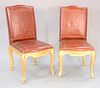 Fourteen Ralph Lauren Dufie dining chairs, upholstered with cognac alligator embossed leather and nail bead trim, cabriole legs with hoof feet, sun-fa