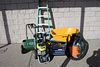 Group lot to include a power sprayer, shop vac, spreader, wheel barrel, tool box, and ladder.