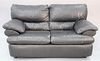 Black leather two-cushion loveseat, ht. 37", wd. 66", dp. 36".