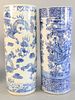 Two Chinese blue and white porcelain umbrella stands, one with painted dragons, the other with painted landscape, ht. 24".