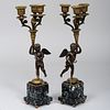 Pair of Patinated Gilt-Bronze and Verde Antico Marble Putto Form Three Light Candelabra