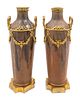 A Pair of Louis XVI Style Gilt-Metal-Mounted Pottery Vases
Height 10 x width 4 inches