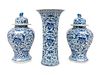 A Chinese Blue and White Porcelain Three-Piece Garniture and a Delft Fluted Vase Height of covered vases 18 x diameter 10 1/2 inches; height of ribbed