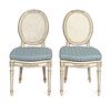 A Pair of Louis XVI Style White-Painted and Caned Chaises
Height 38 x width 19 x depth 17 1/2 inches.