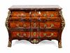 A Regence Style Gilt-Bronze-Mounted Kingwood and Tulipwood Commode
Height 36 1/2 x length 51 1/2 x depth 24 inches.